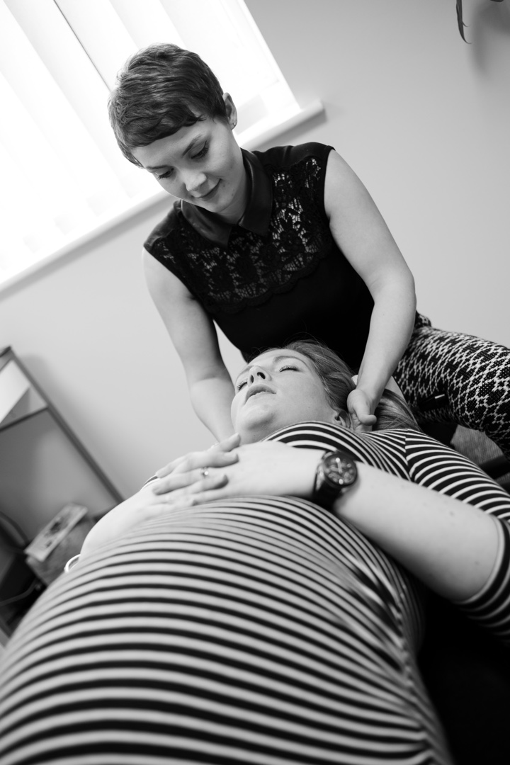 Naomi delivering chiropractic treatment to a pregnant lady.